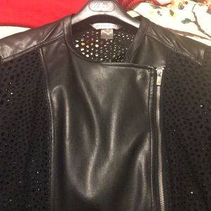 Black jacket with silver hardware.Zipper.